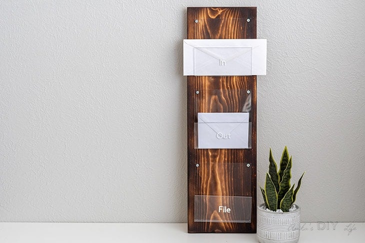 Plexiglass and wood mail holder with letters in it