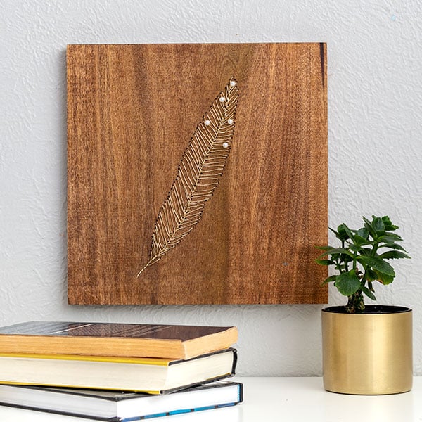 Learn to make this creative and stunning DIY wood wall art using gold wire. It's like embroidery on wood and so easy to make!