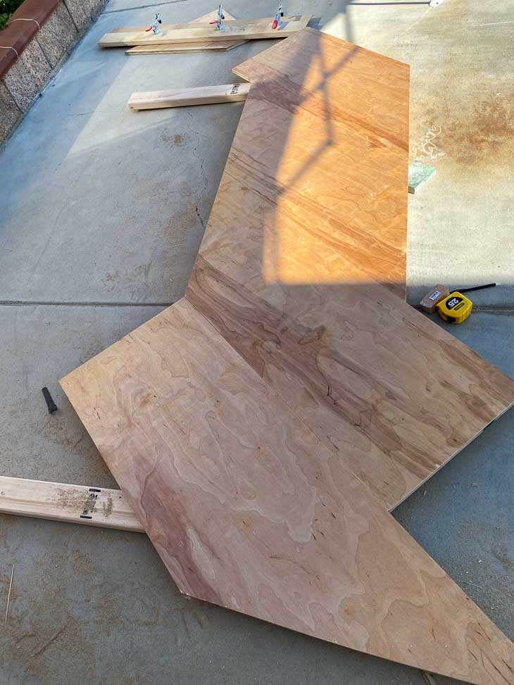 All plywood lined up on the DIY headboard frame