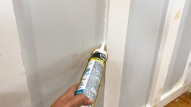Caulking board and batten wall to make it perfect!