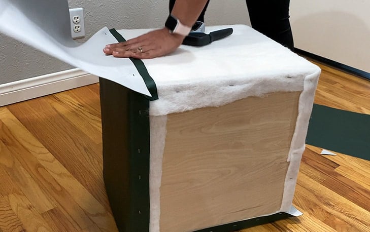 Attaching vinyl fabric to one side of the box