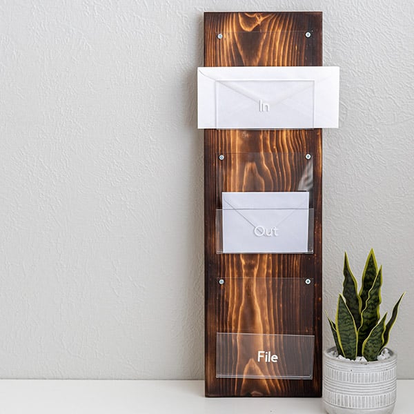 Plexiglass and wood mail holder with letters in it