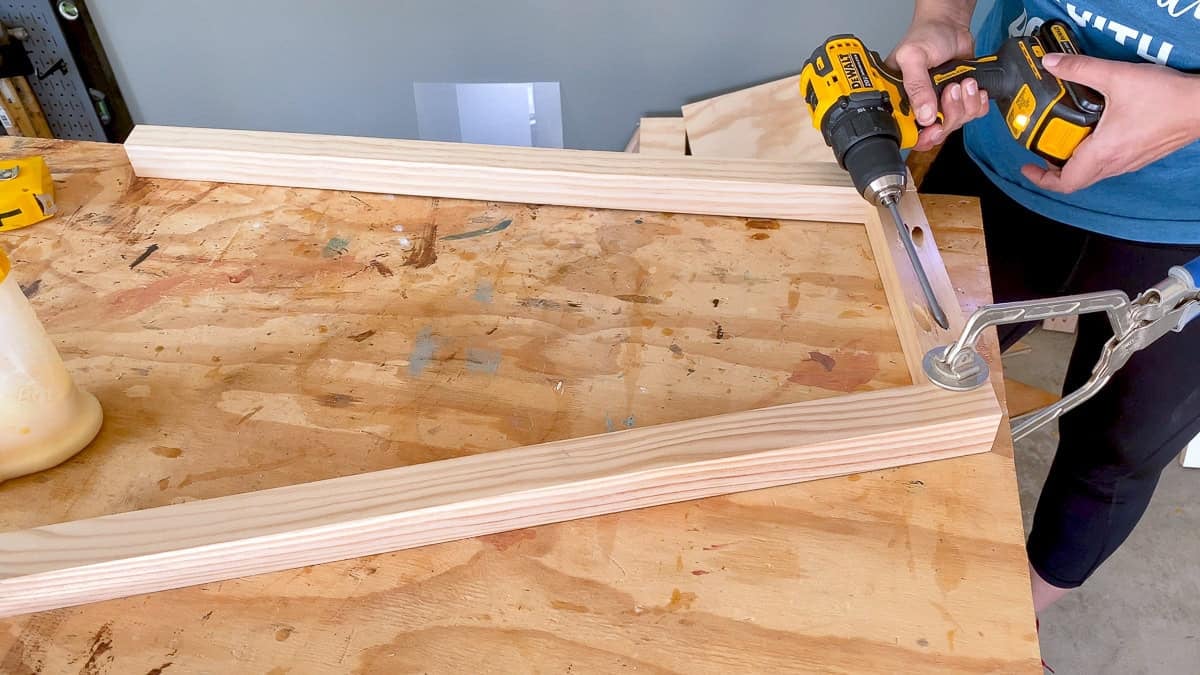 Anika building the legs for the modern DIY a frame desk