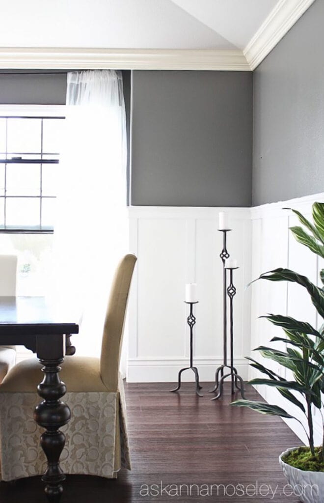white half wall board and batten in dining room with gray walls