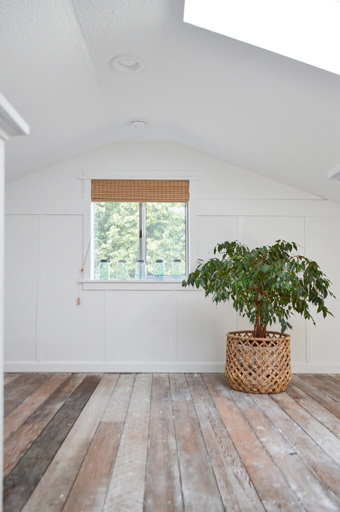 white board and batten wall in a room with vaulted ceiling