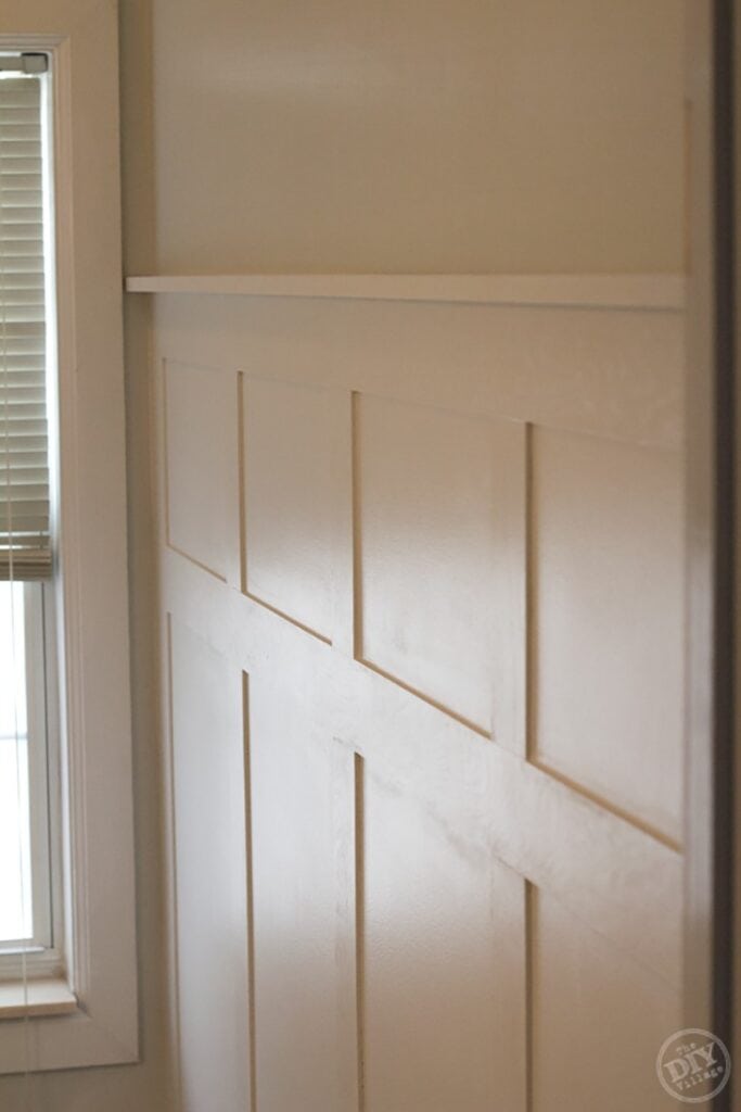 White three quarter board and batten wall in white bathroom