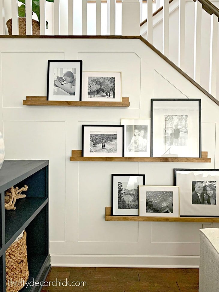 white board and batten on stair wall with picture ledges