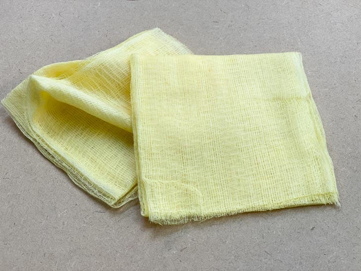 two tack cloths on workbench