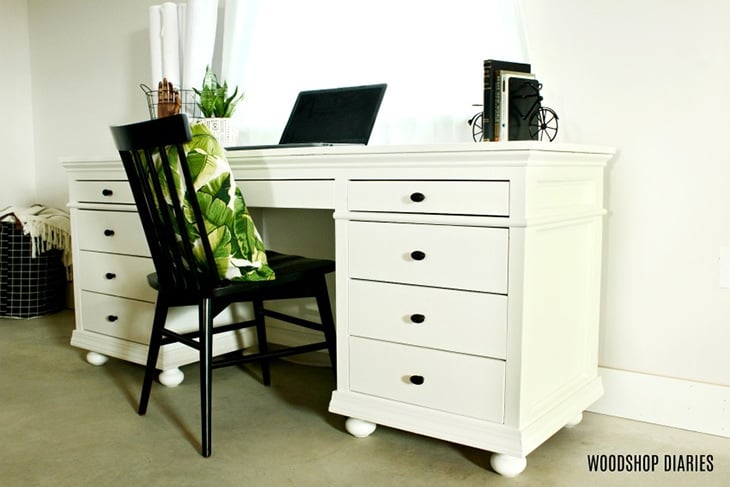 Traditional style desk with storage painted white with bun feet