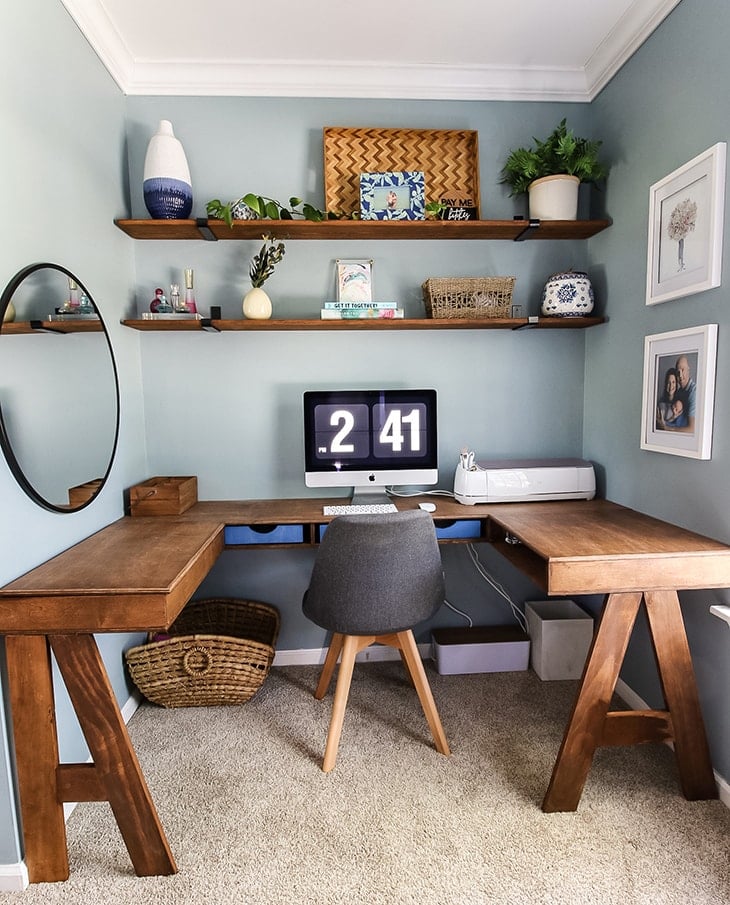 Built in U shaped desk with storage and open shelving above