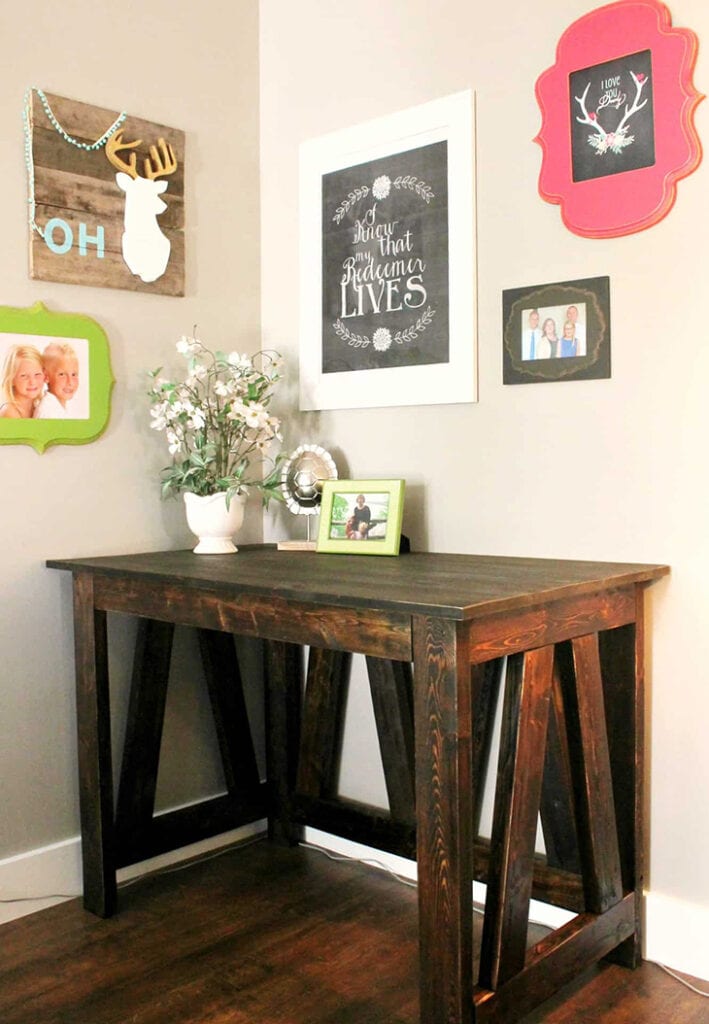 DIY desk made from 2X4s with boards in an inverted V for detail