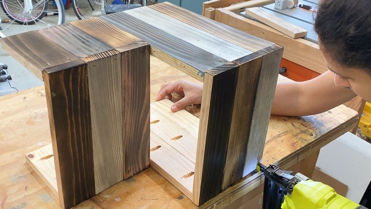 Attaching the treads of the step stool to the other side