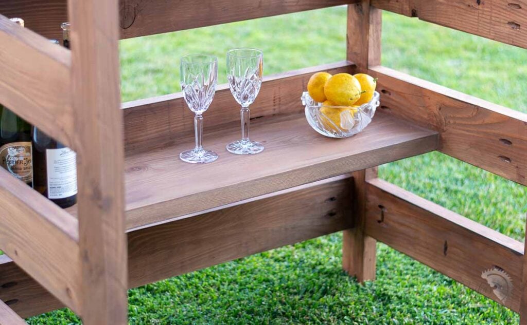 close up of lower shelf in the handmade wooden bar