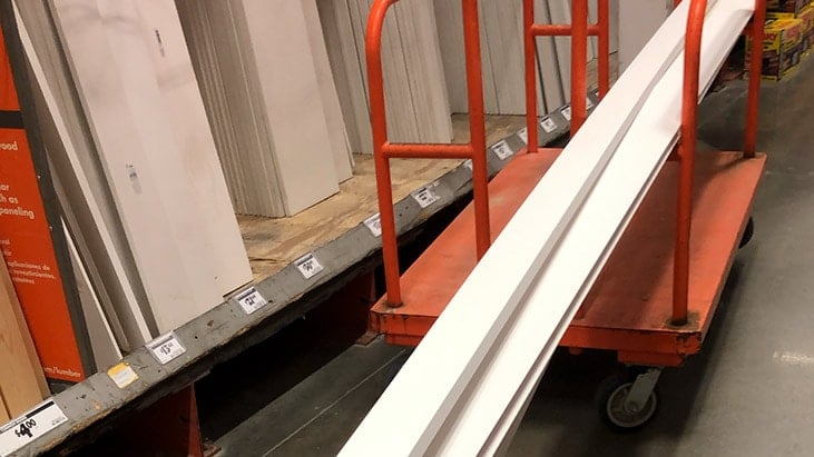cart full of pre-primed boards in Home Depot