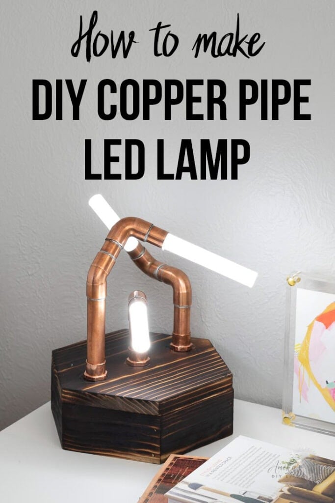 DIY copper pipe lamp with acrylic rods on a desk with text overlay