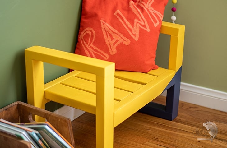 close up of yellow and navy blue bench