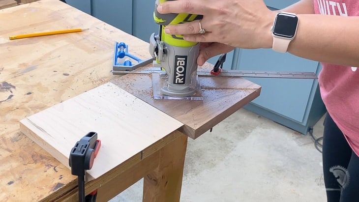 Routing stripes in walnut with a trim router to make the DIY wall clock