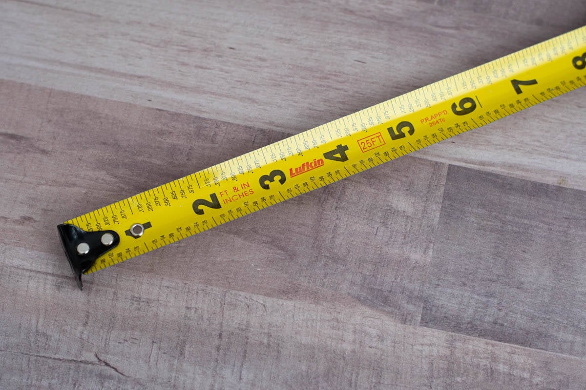 Tape measure with fractions and decimals marked