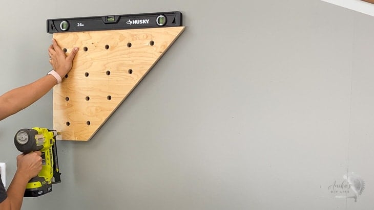 Attaching plywood pegboard to the wall