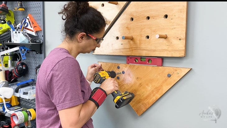 Attaching magnetic plywood to the wall