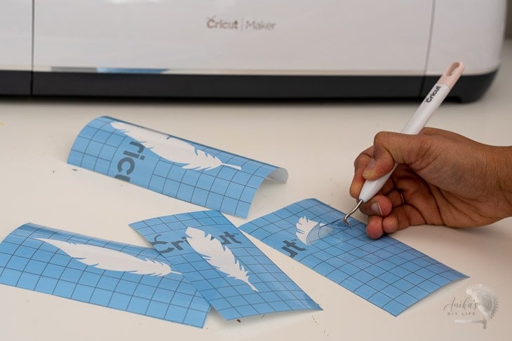 preparing the reusable stencils on Cricut stencil vinyl for the wall.