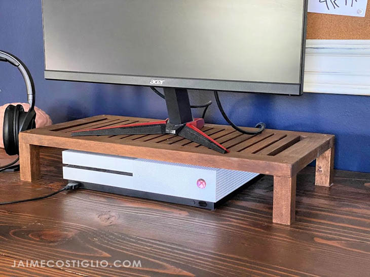 slatted computer riser sitting on a desk