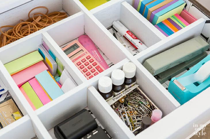 drawer divider with desk supplies in all the sections