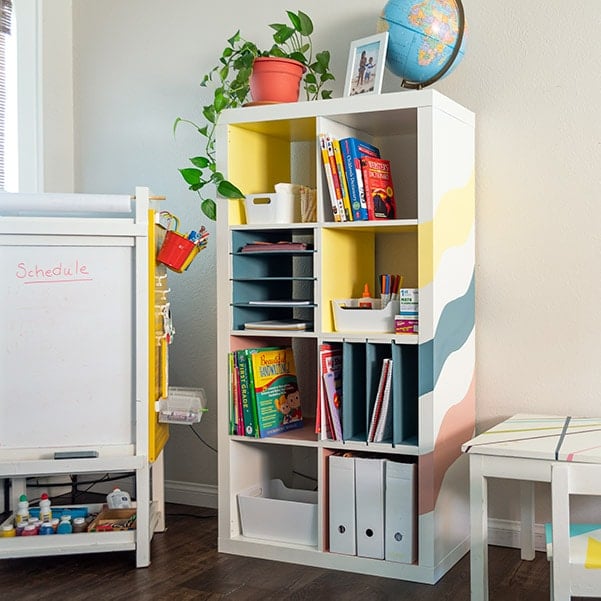 Learn how to make your own home-office, back to school, or homeschool organizer with this easy DIY Ikea Kallax Shelf hack. The DIY built-in inserts are perfect for organizing paper and folders.