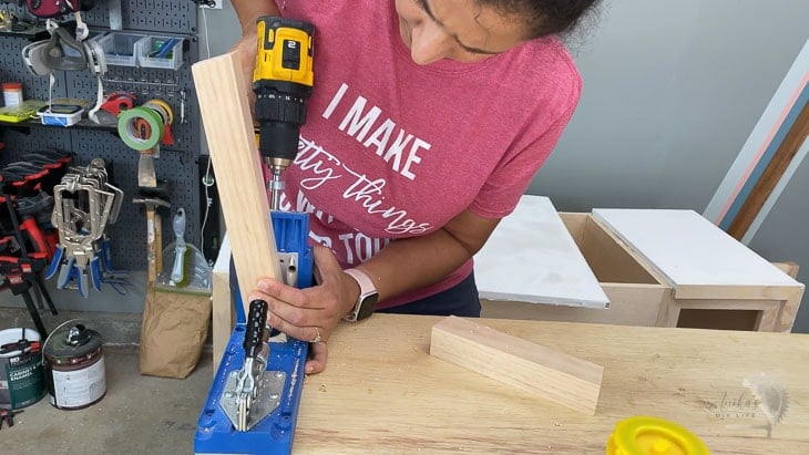 Woman making pocket holes for the bench