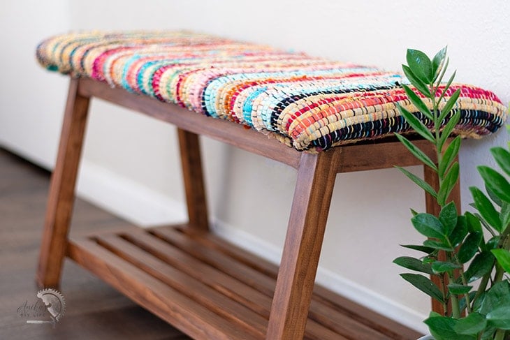 close up of the fabric of the diy bench with shoe storage