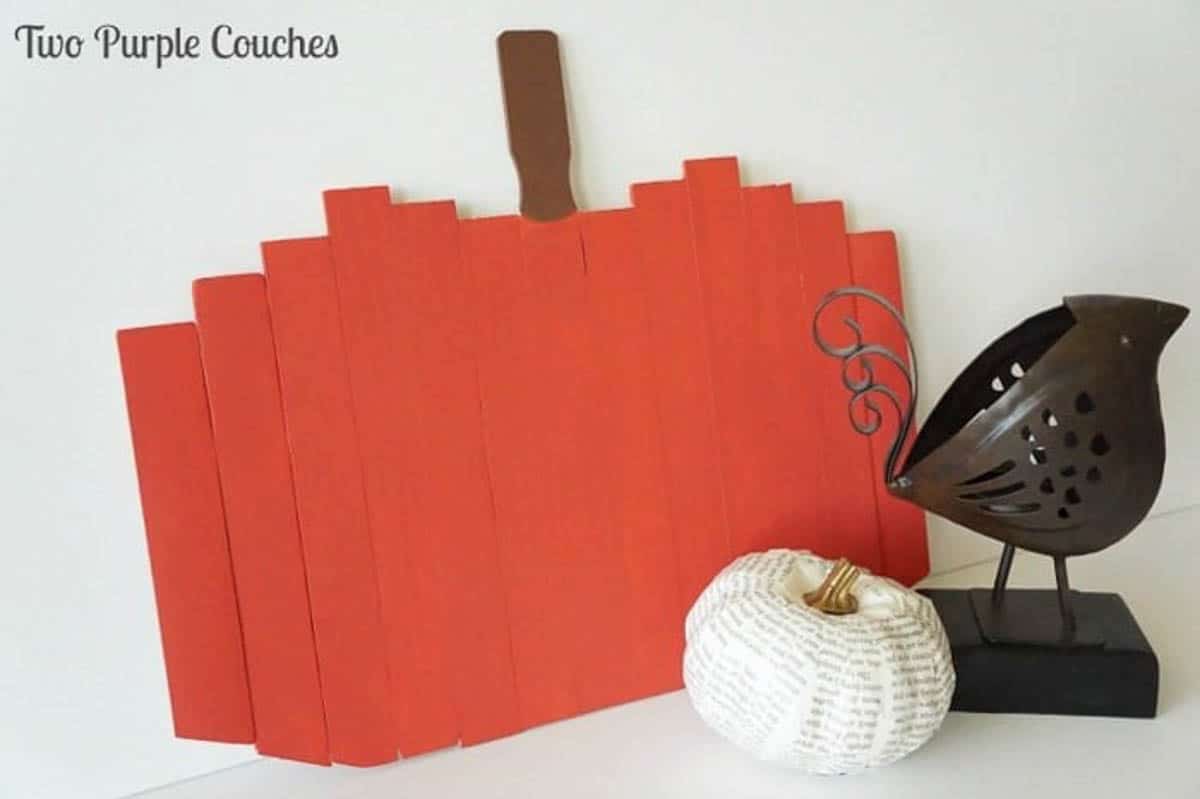 Wood pumpkin made from paint sticks painted orange