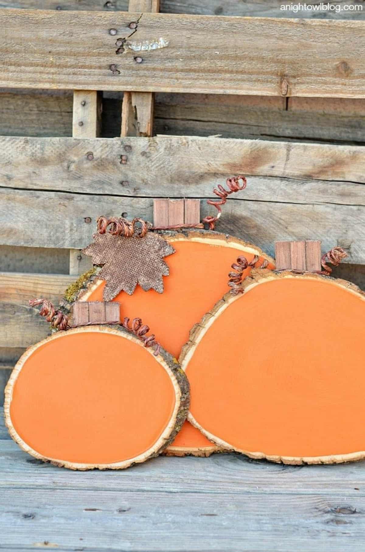 Wood slice pumpkins painted orange