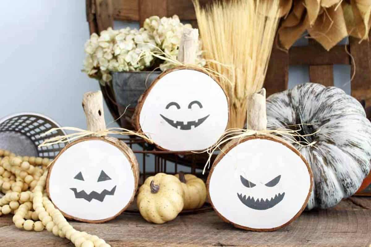 wood slices with jack-o-lantern faces