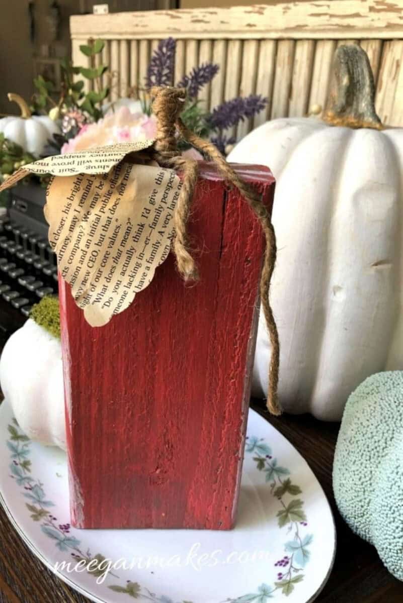 scrap wood pumpkin with book page leaves