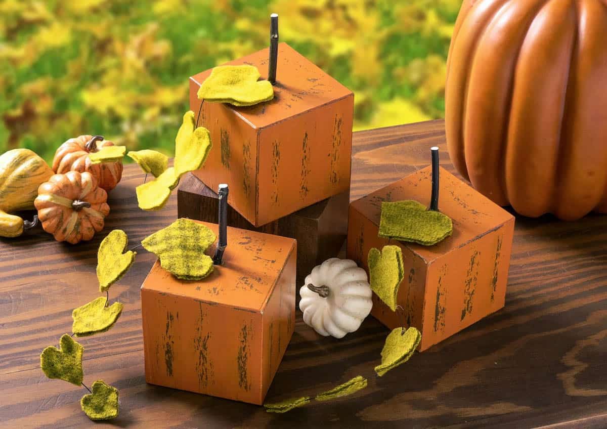 wood block pumpkins with felt leaves