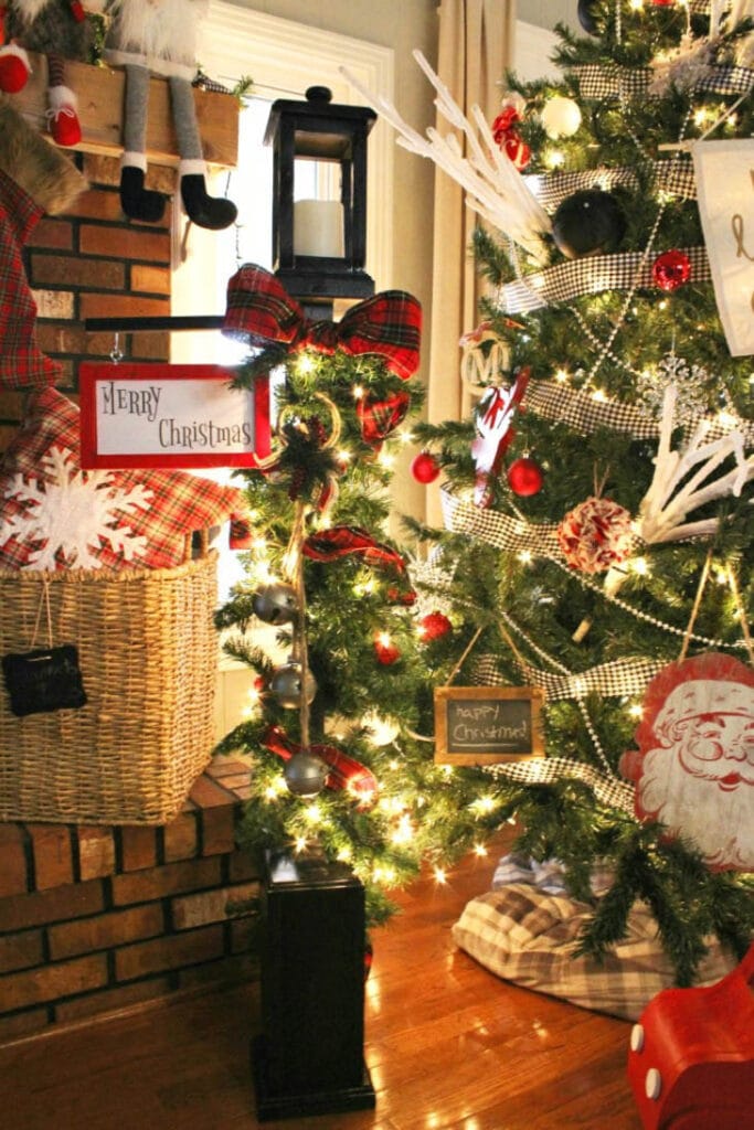 Scrap wood stocking light pole next to a lighted Christmas tree
