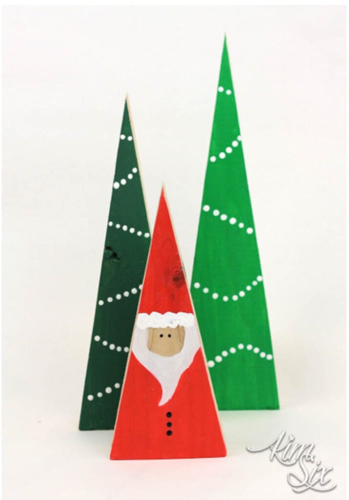 2 triangle scrap wood trees and a triangle scrap wood santa