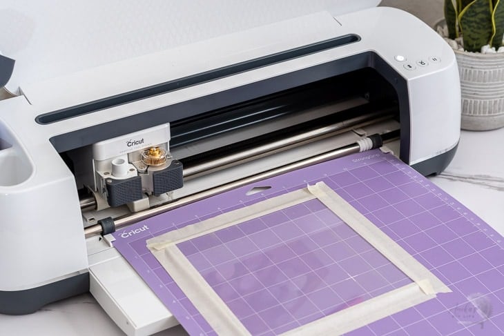 Loading mat on Cricut Maker to engrave plexiglass