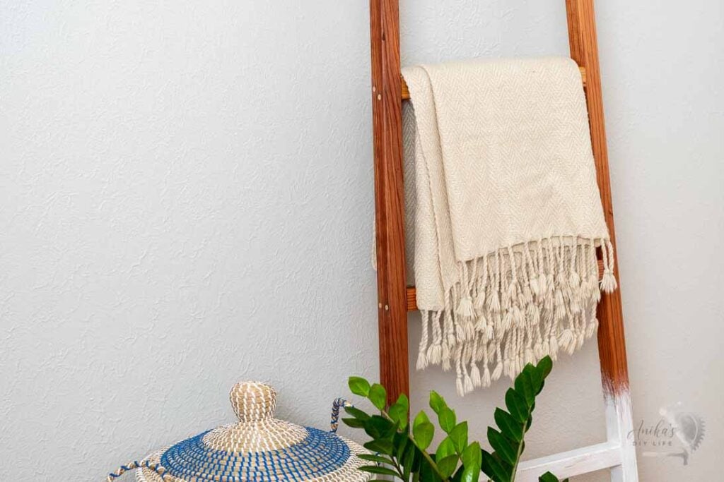 picture of DIY blanket ladder with blanket on it.