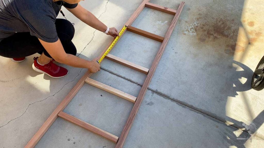 Laying out the boards for the DIY blanket ladder