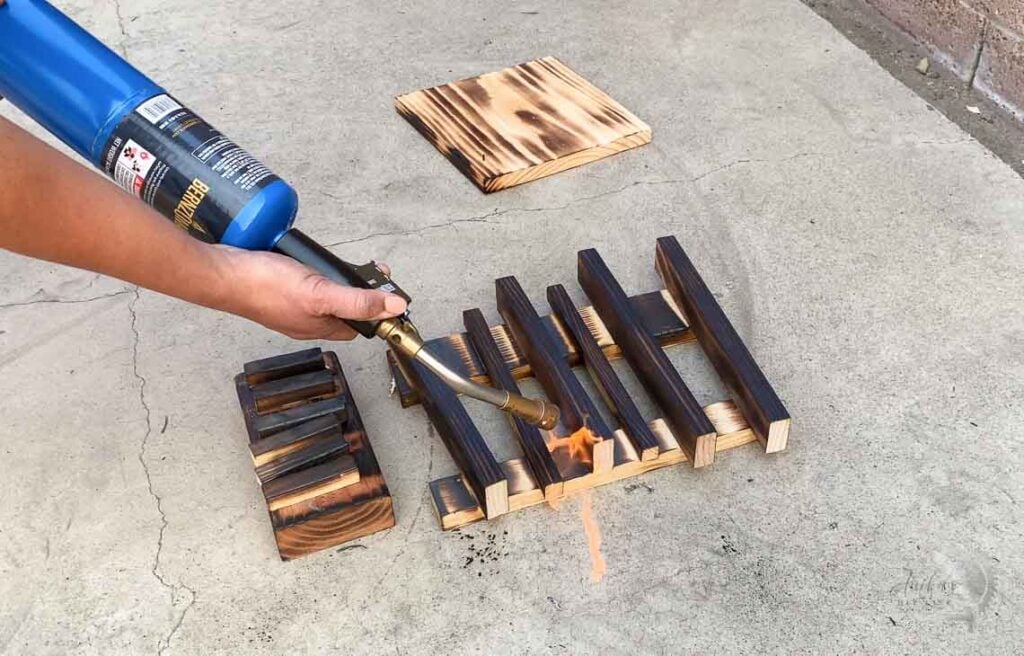 Torching the wood using a Propane torn