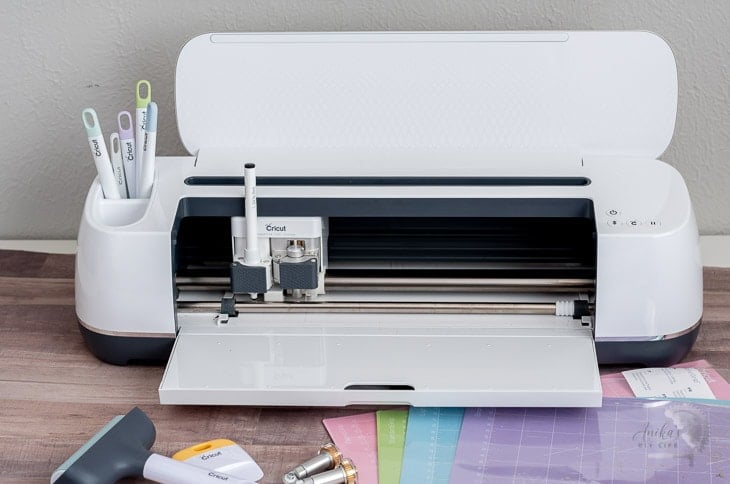 Cricut maker with all its accessories on the table