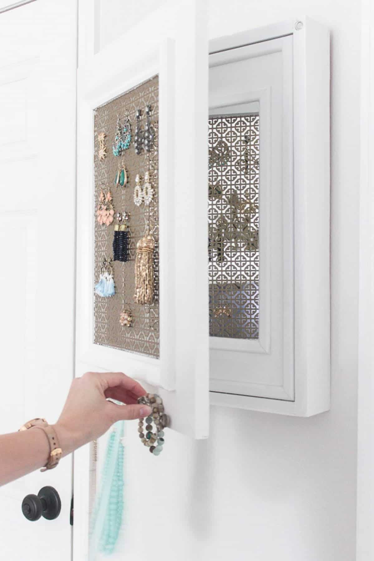hanging jewelry cabinet with secret compartment