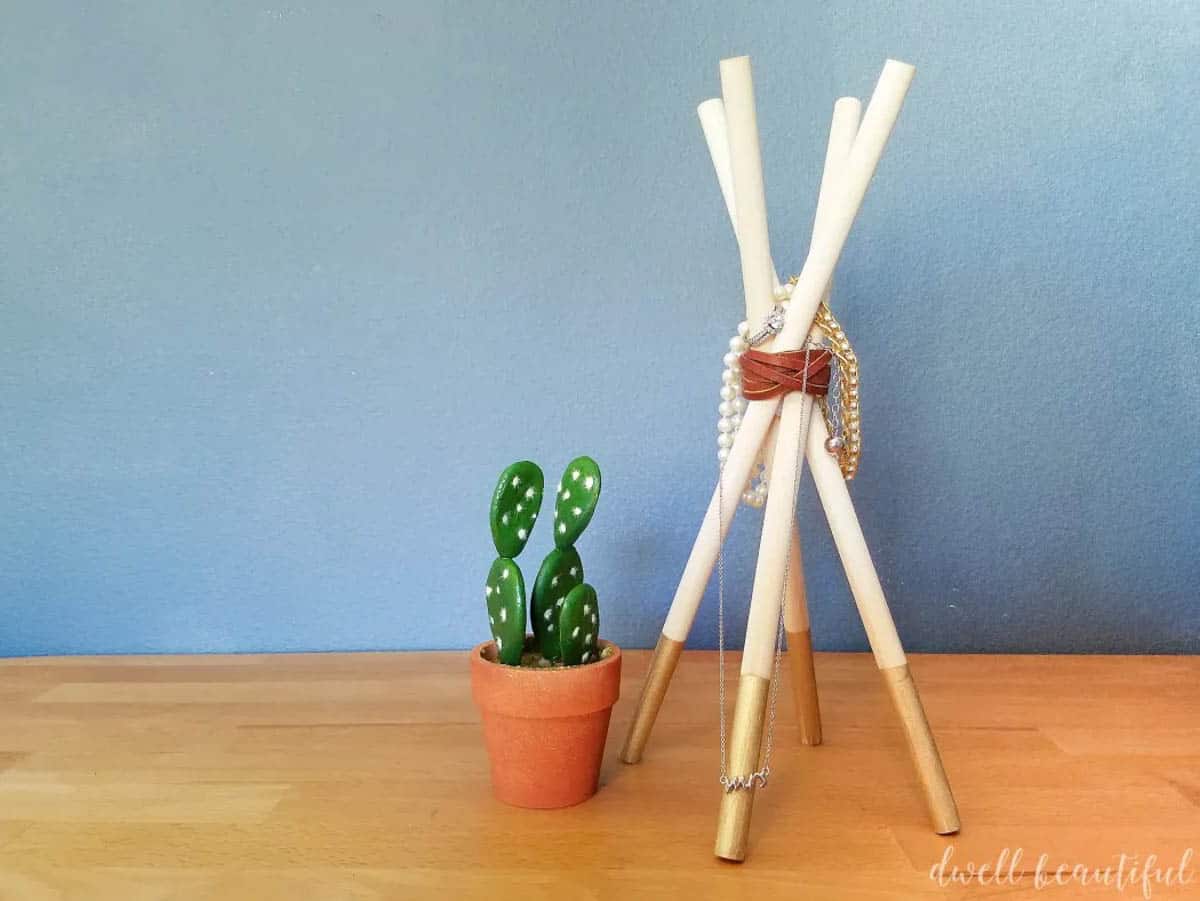 Jewelry holder made from dowels to look like a teepee