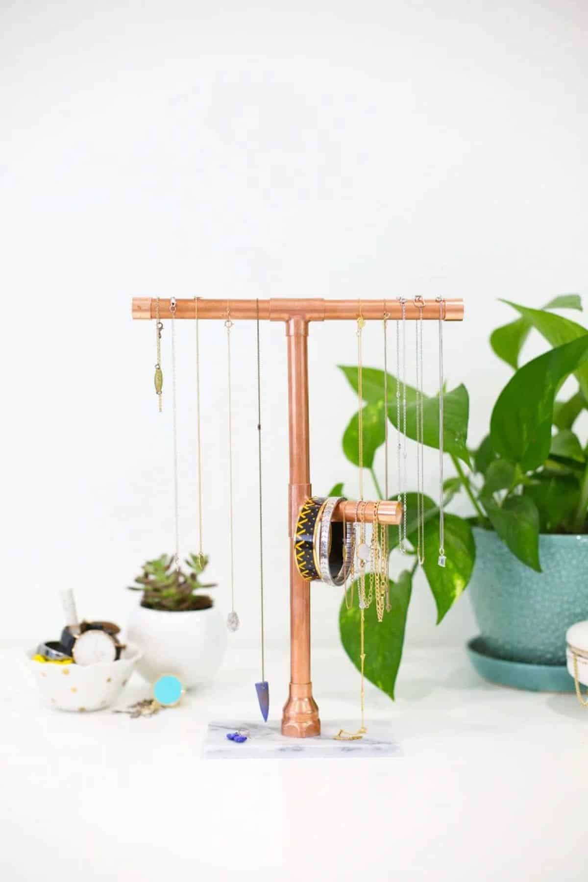 Jewelry stand made from copper pipe with marble base