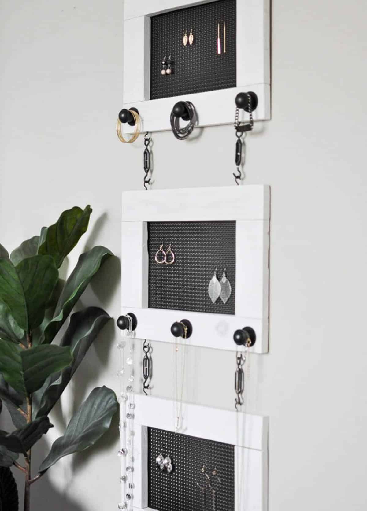 Hanging DIY jewelry organizer with three sections