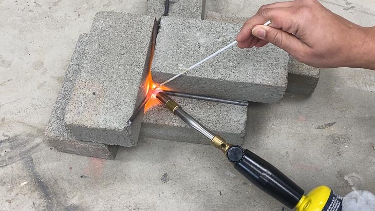 brazing two steel rods together using a blow torch