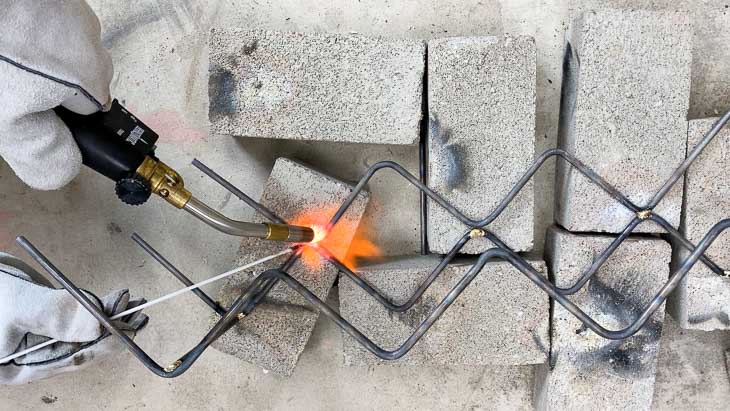 Brazing steel rods to make the two tier wine bottle rack