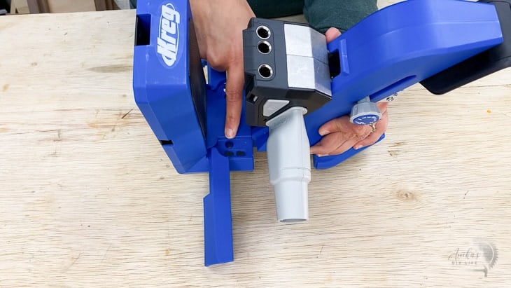 woman pointing to the mounting holes on the Kreg 720