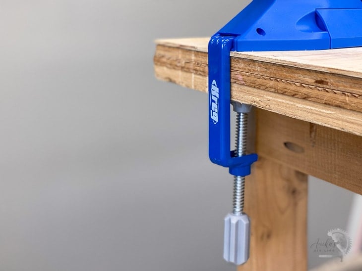 Jig clamp holding Kreg jig 720 to the workbench